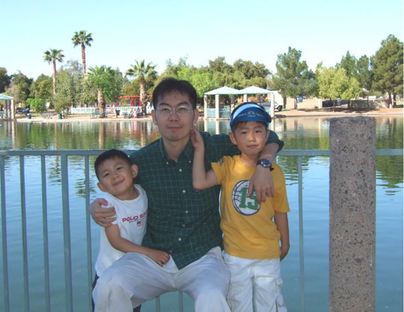 Dad holding on tight to his sons